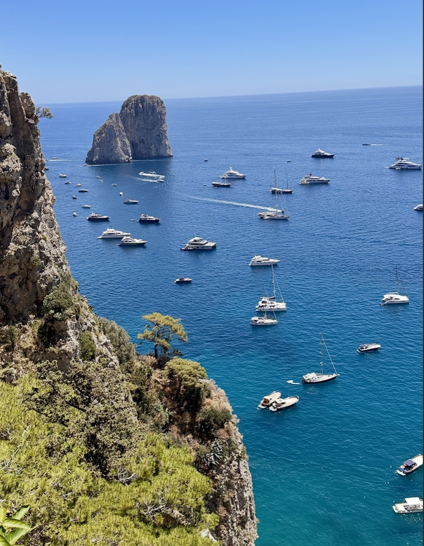 Boats anchored below the cliffs of Capri