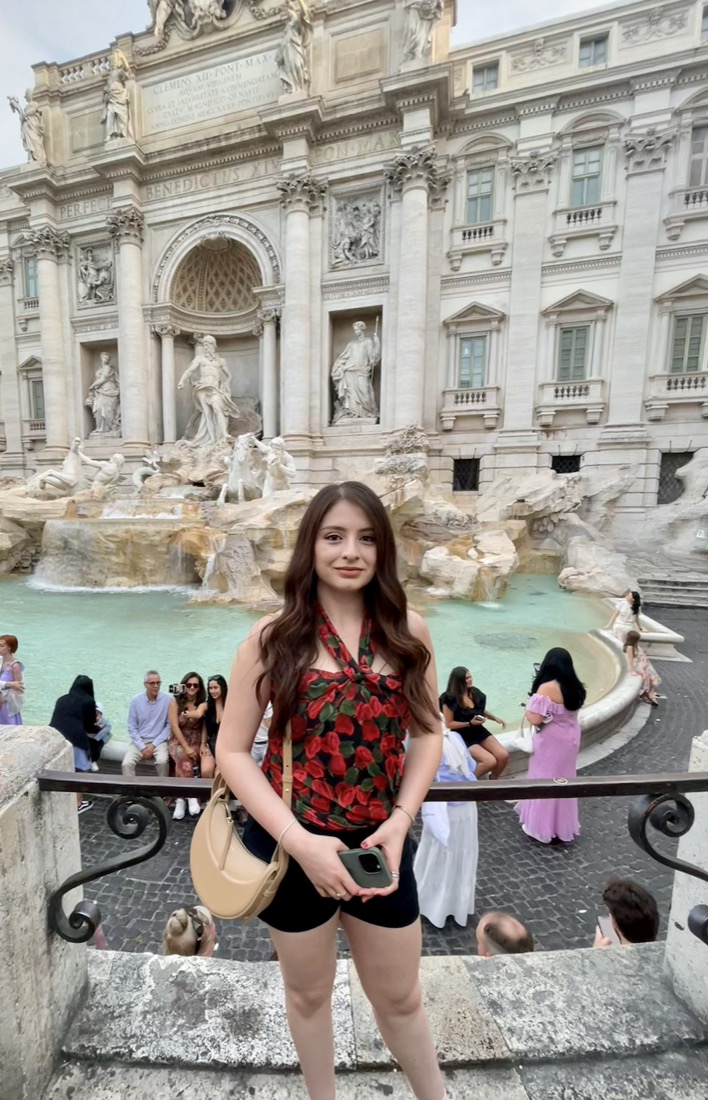 Standing in front of the Trevi Fountain in Rome